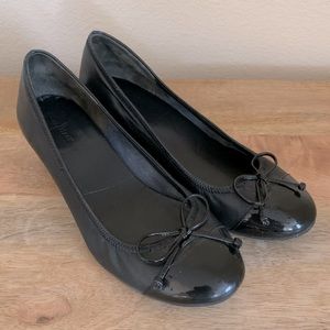 Cole Haan black leather wedge with round patent leather toe and Nike Air insole